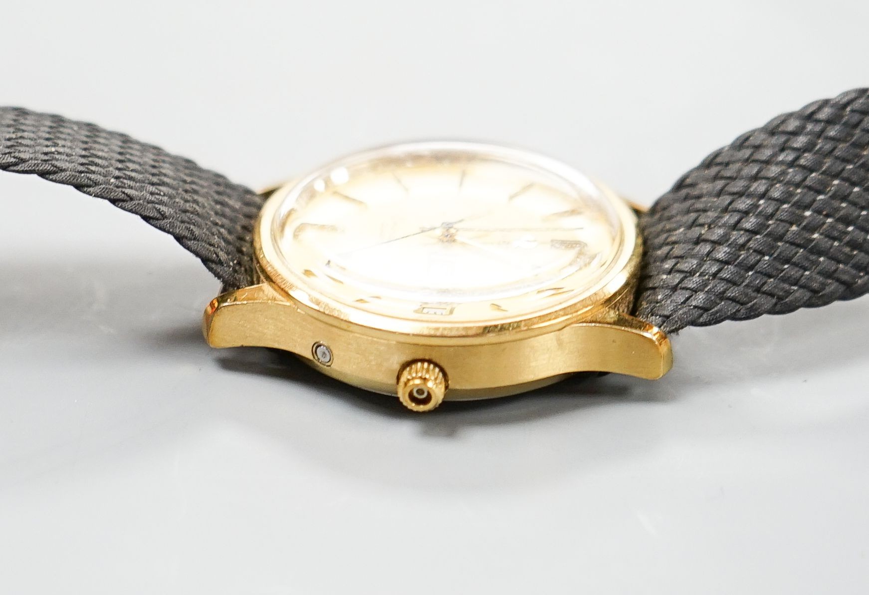 A gentleman's steel and gold plated Omega Seamaster quartz wrist watch, on associated fabric strap, no box or papers